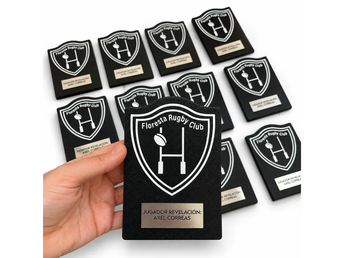 Placas de distinción negras y blancas para un club de rugby